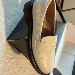 Beige colored women's penny loafers.  Size 8/40